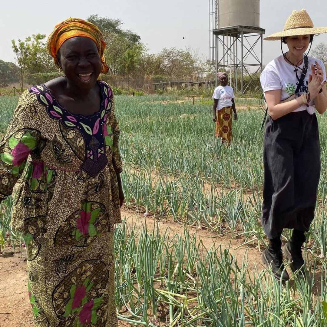 Jaimie Alexander and women onion farmers in The Gambia